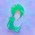 a pair of green earrings sitting on top of a table
